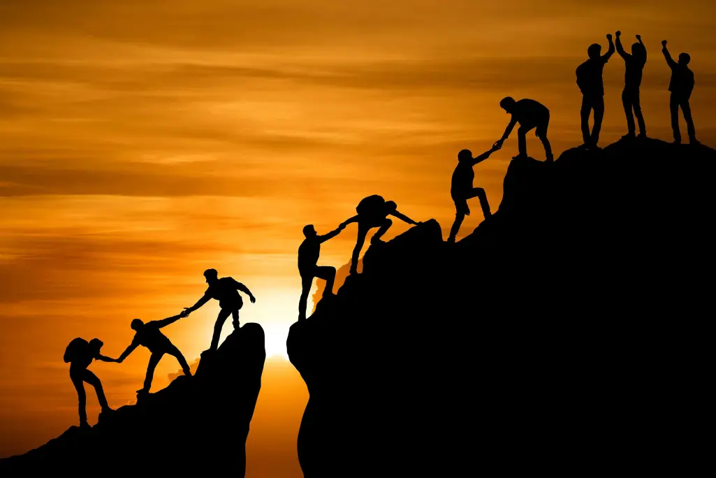 People climb mountain at sunrise, holding hands and cheering, teamwork, Sto