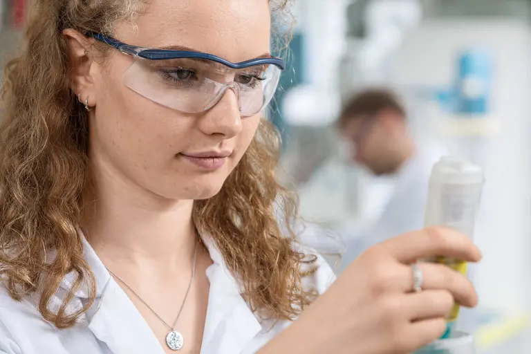 Student explores in the lab, checks the result