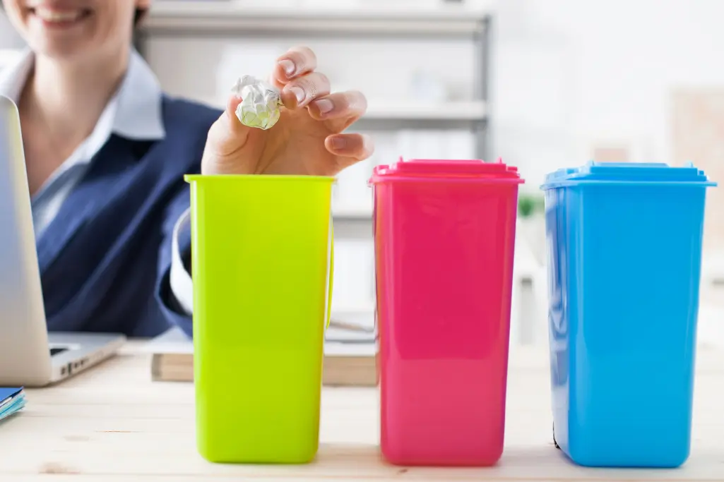 Separate garbage at work, in the office, colorful mini-bins