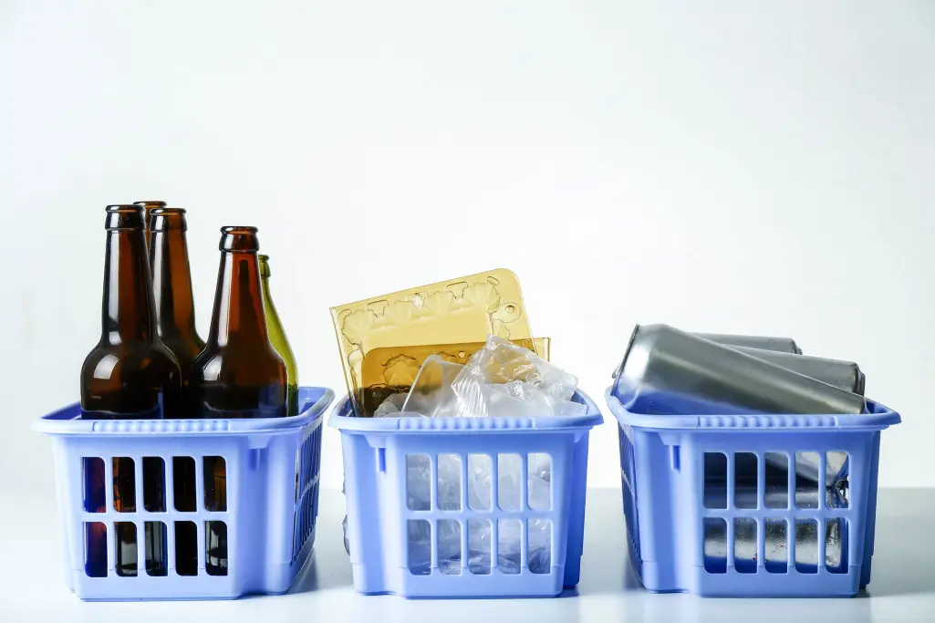 Separation of recyclable waste in blue baskets. Product responsibility
