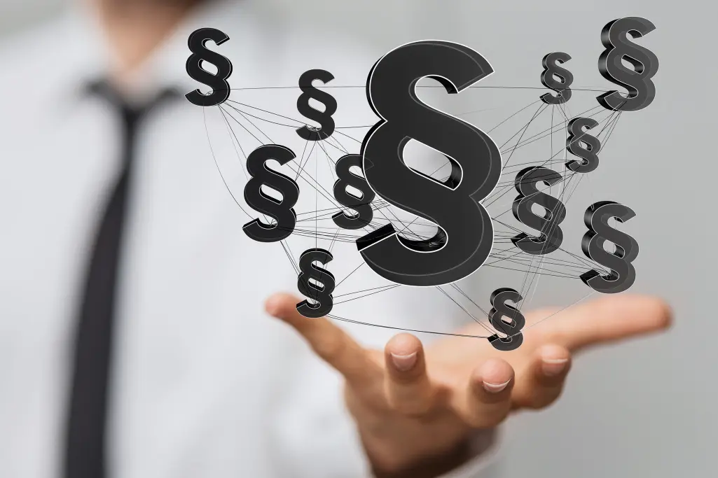 Businessman holds paragraphs in his hand. Compliance with rules and social standards