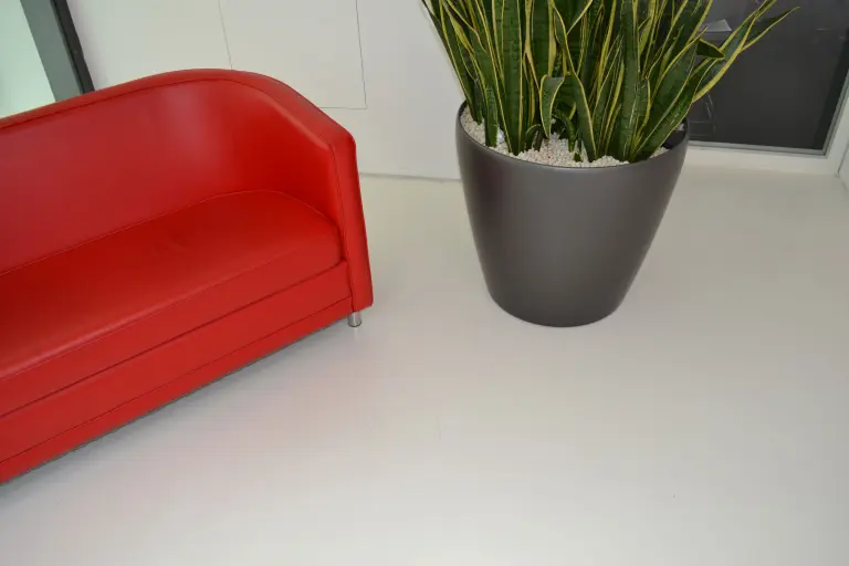 Low VOC content floor systems Floor coatings Red sofa on floor