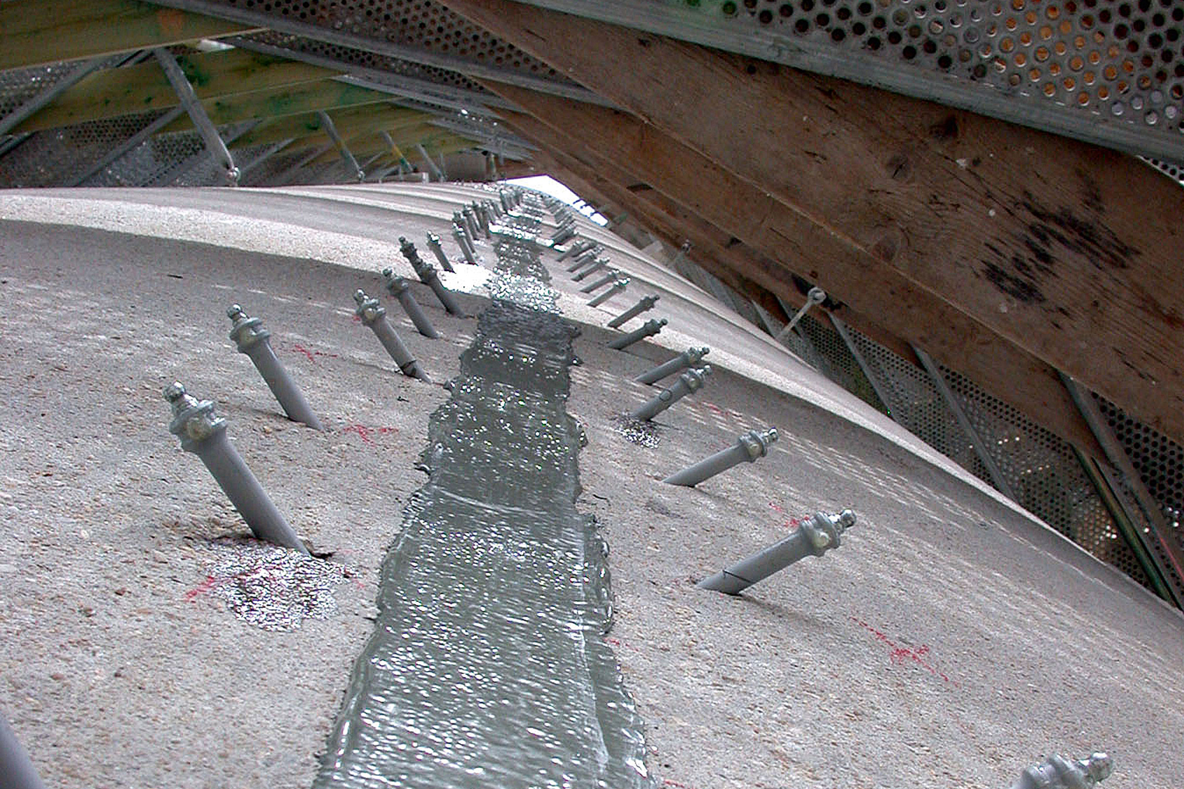 Permanent sealing of cracks in concrete members